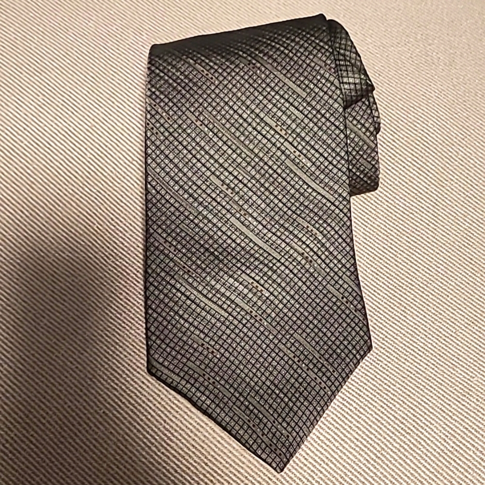 DKNY men's silk tie , brown geometric designs with tiny red dots color.